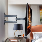Black powder-coated finish full motion TV mount for living room setup