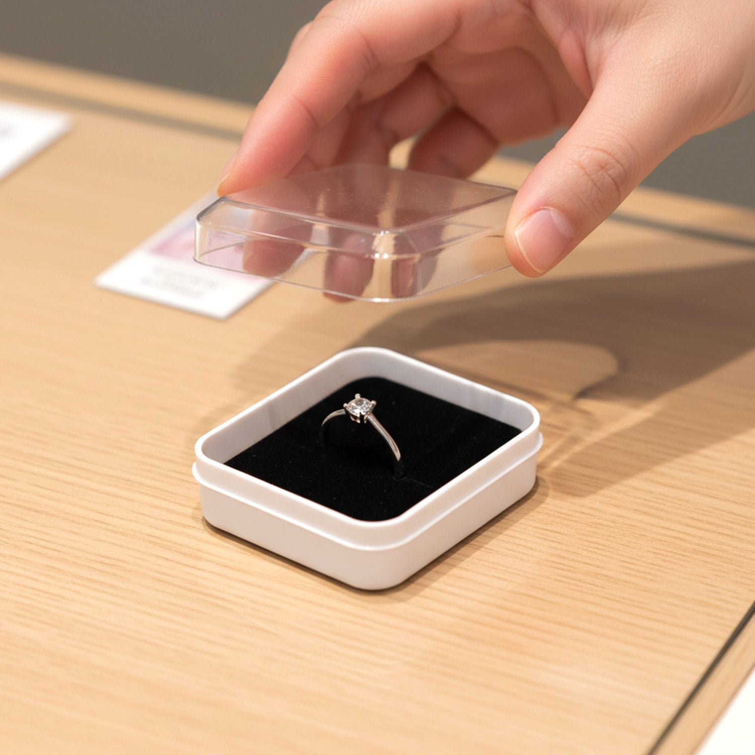 Top-down view of a single mini jewellery storage box with cushioned base