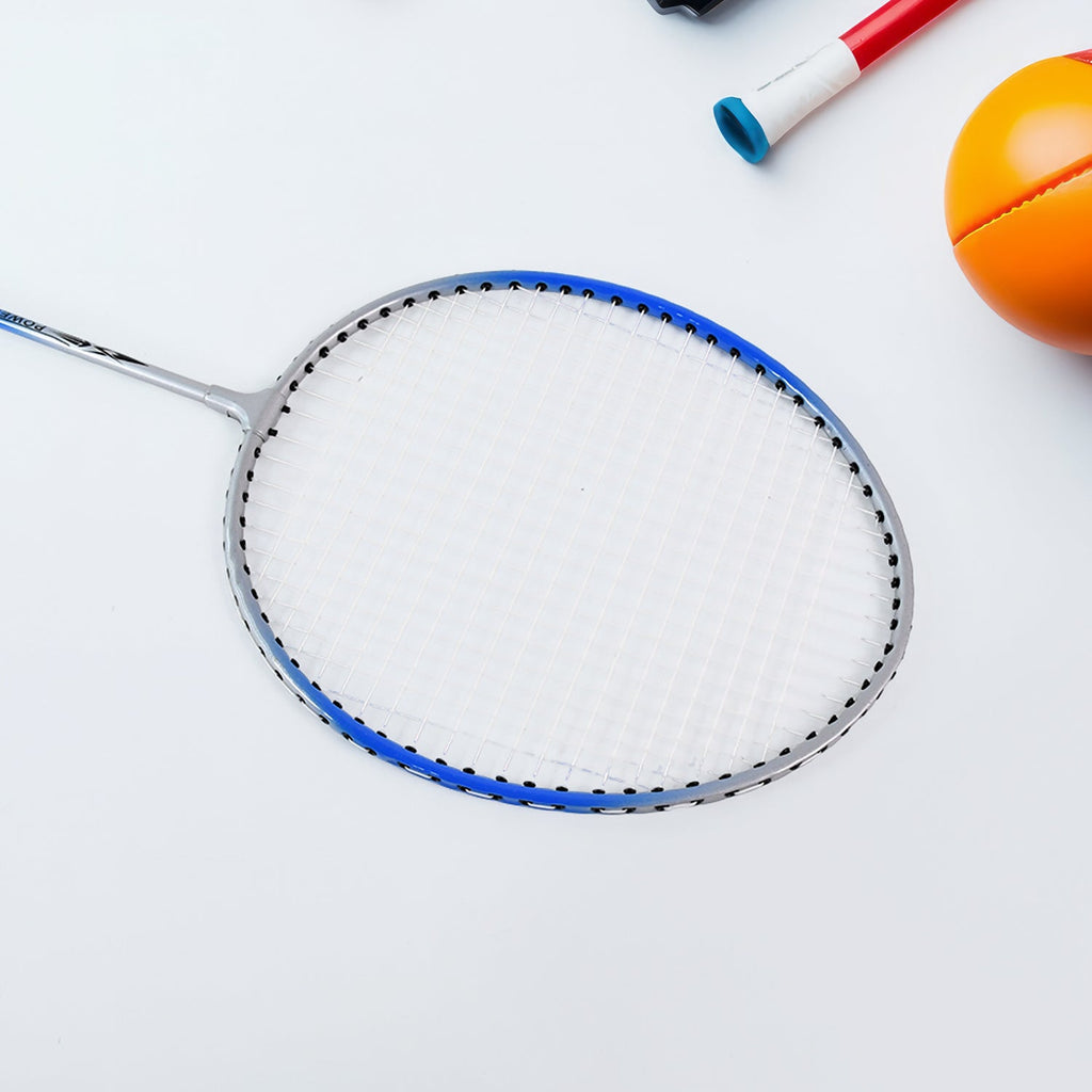 Family playing badminton outdoors using premium badminton set