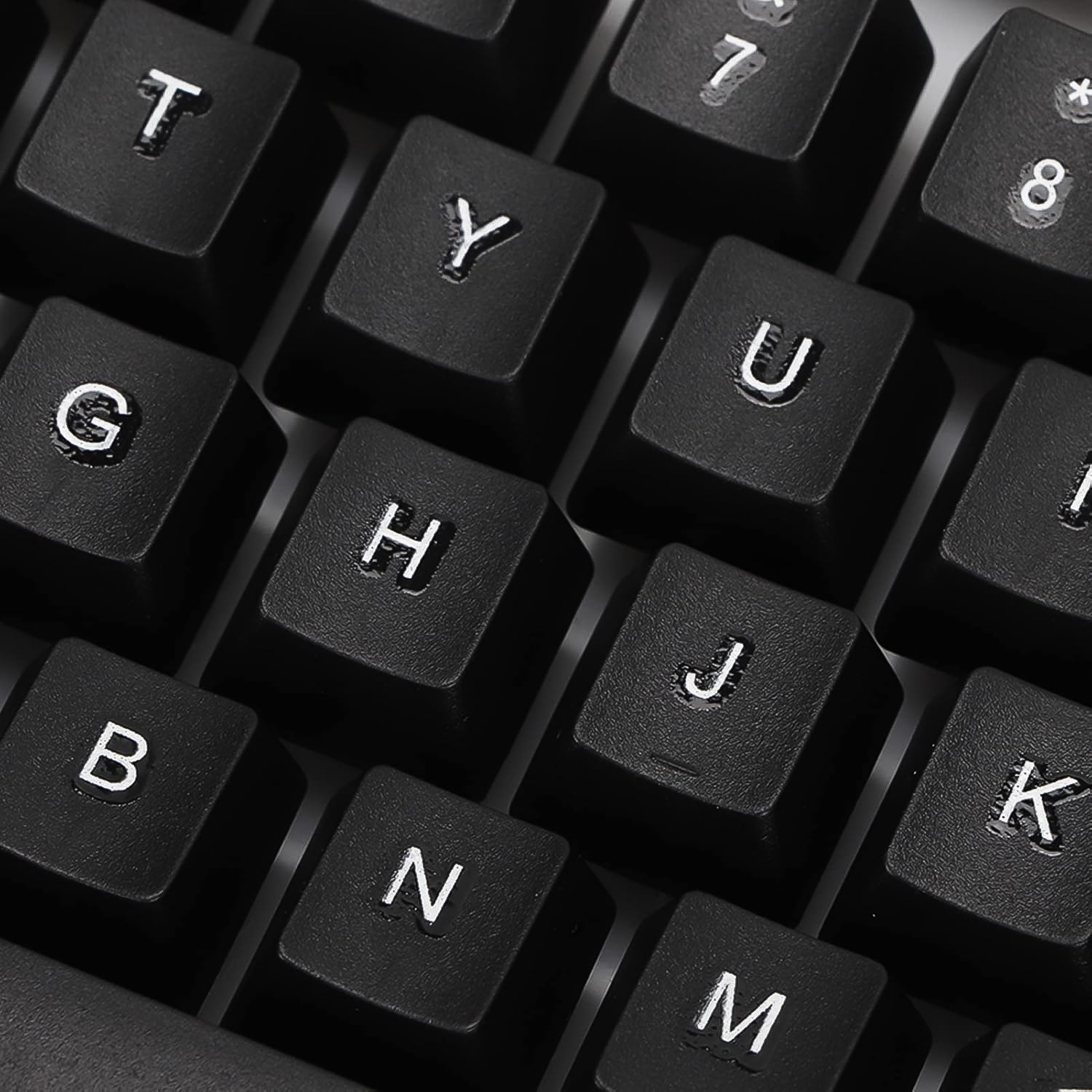 Angled view of the wired keyboard, highlighting its full-size layout and ergonomic key placement.