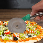 A hand demonstrating the Quickslice stainless steel pizza cutter slicing through a freshly baked pizza.