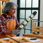 Close-up of spirit level with fluorescent green bubble vial for clear visibility