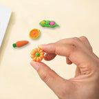 Brightly colored cute erasers arranged for a fun display on a white background.