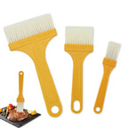 Close-up of the three silicone basting brushes in a kitchen setting.