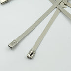 WipeTech's corrosion-resistant stainless steel cable fasteners against a metallic background.