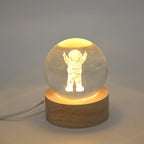 A Moon Crystal Ball Lamp displayed on a bedside table, creating a serene bedroom decor ambiance.