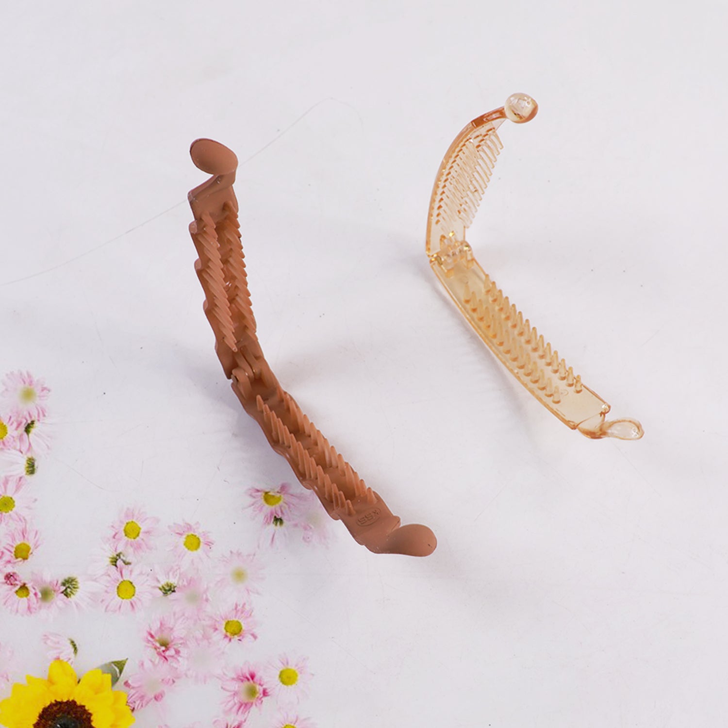 Plastic claw hair clip designed to hold hair firmly and stylishly