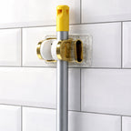 Wall mount mop and broom organizer ideal for kitchen and utility spaces