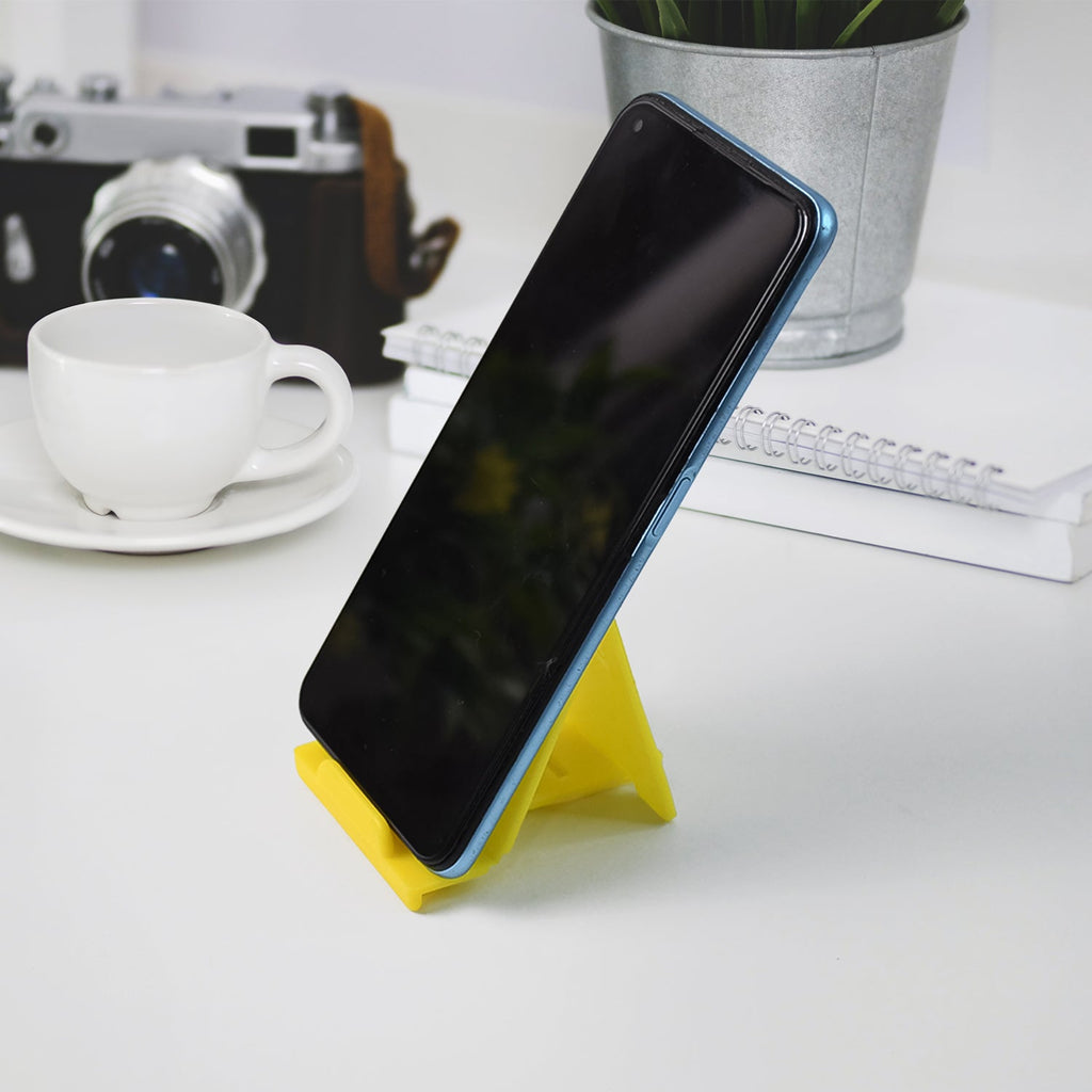 Foldable mobile phone stand placed on desk for stable support