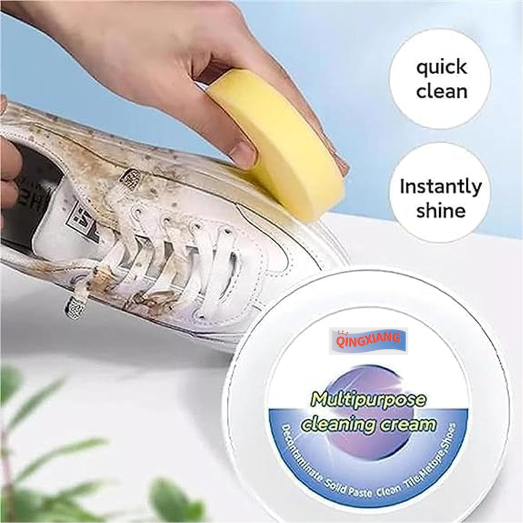 Person using Velvet Wipe shoe cleaner to effortlessly remove a dark stain from a white sneaker.