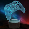 3D Illusion LED night lamp with gaming controller design illuminating in a dark room