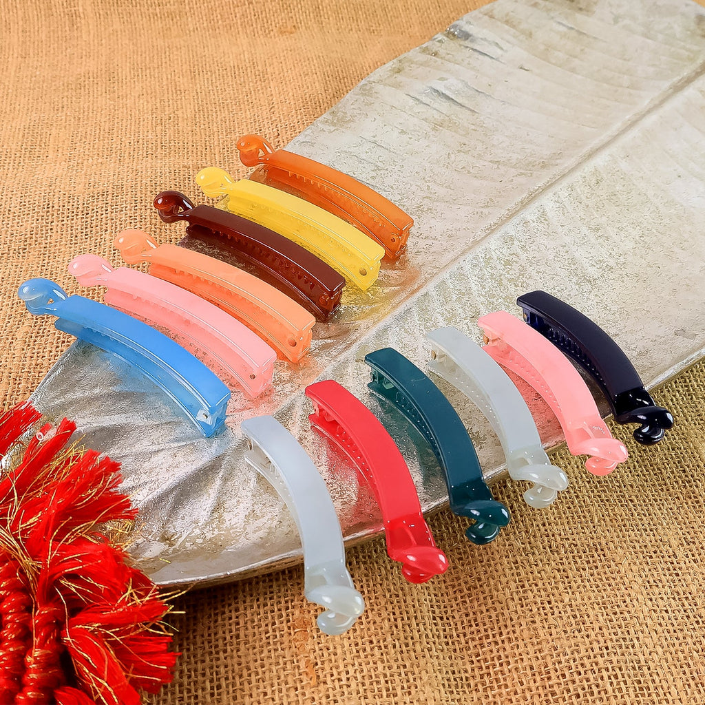 Set of 12 vibrant banana hair clips made from durable plastic