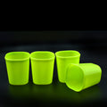 Set of four clear unbreakable plastic drinking glasses.