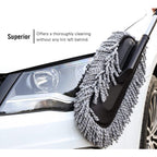 Person holding the comfortable grip of the Velvet Wheels Car Dust Brush, ready for detailed cleaning.