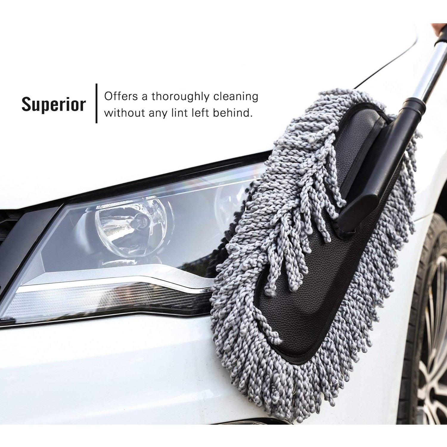 Person holding the comfortable grip of the Velvet Wheels Car Dust Brush, ready for detailed cleaning.