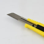 Retractable blade utility knife demonstrating its compact design.