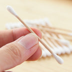 Sustainable cotton swabs made with natural bamboo sticks.