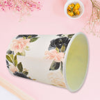 Close-up of disposable paper cups with abstract designs, ready for use.