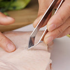 Fish bone tweezer placed on kitchen countertop showing ergonomic handle