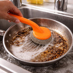 Dish scrubber with ergonomic long handle providing comfortable grip