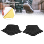 A single Heel Cushion Pad being flexed to demonstrate its elasticity and resilience, made from soft sponge material.