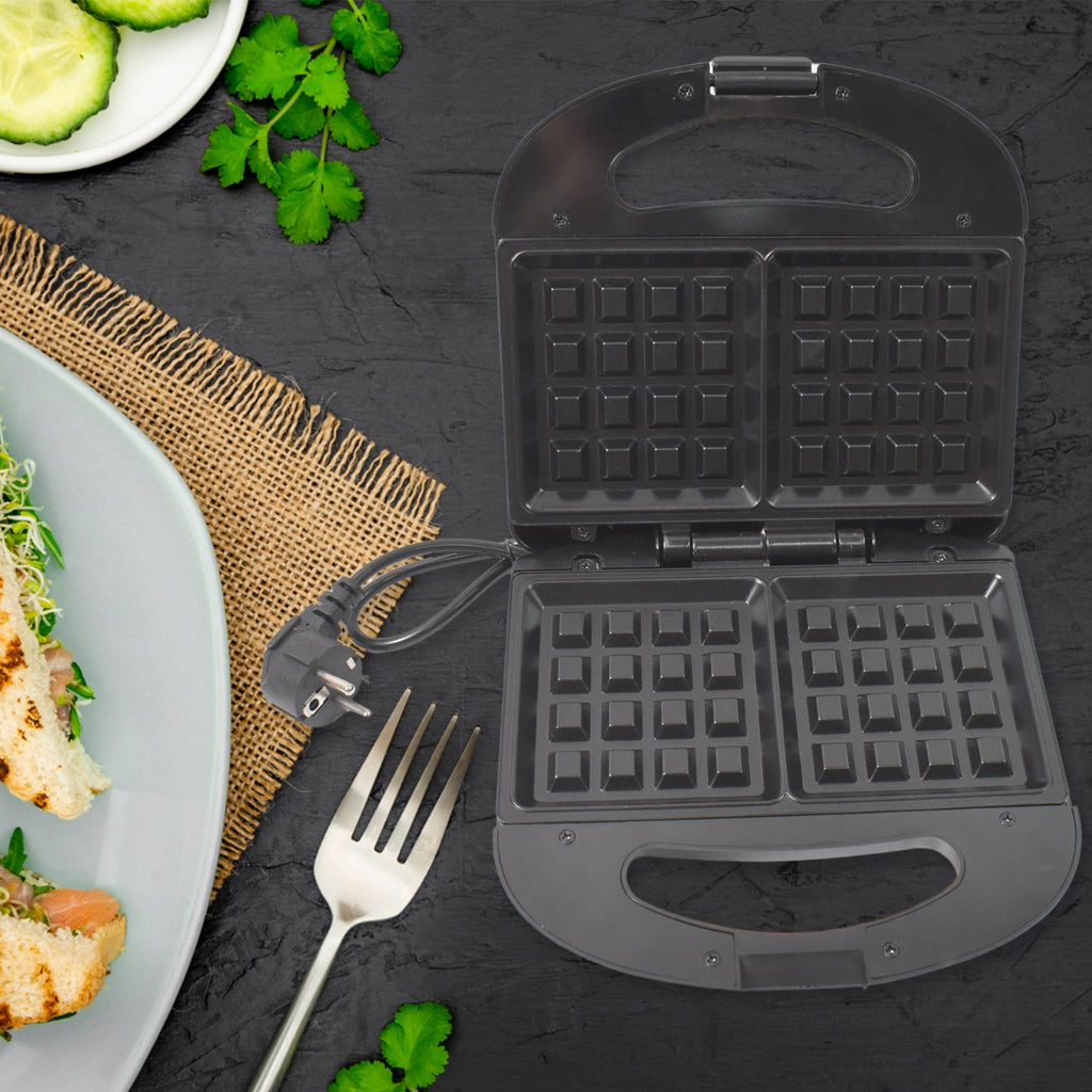 Sleek black Dabster square sandwich maker from a side angle.