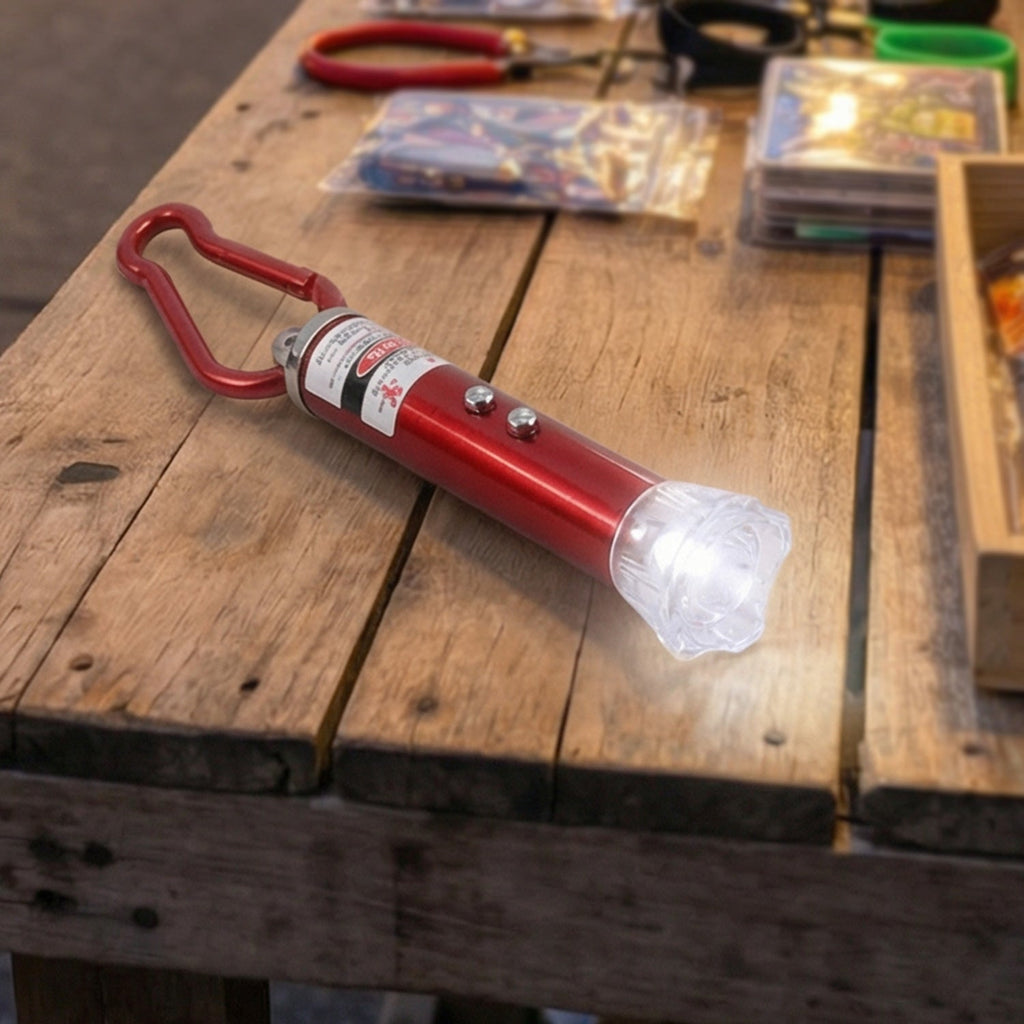 Close-up view of the compact 4-in-1 laser pointer showing its LED light.