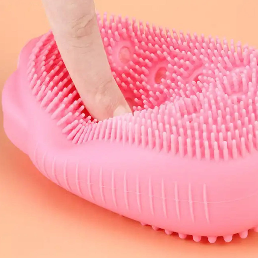 Soft silicone body scrubber with an ergonomic handle for comfortable, easy grip.