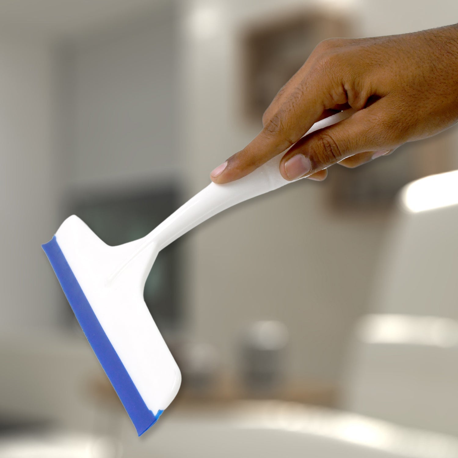 White plastic kitchen wiper with a hanging hole for easy storage.
