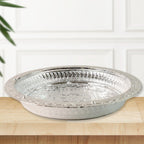 Decorative plastic pooja thali featuring silver finish and floral embossing
