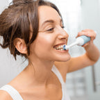 Side view of the electric toothbrush, showcasing its sleek design.