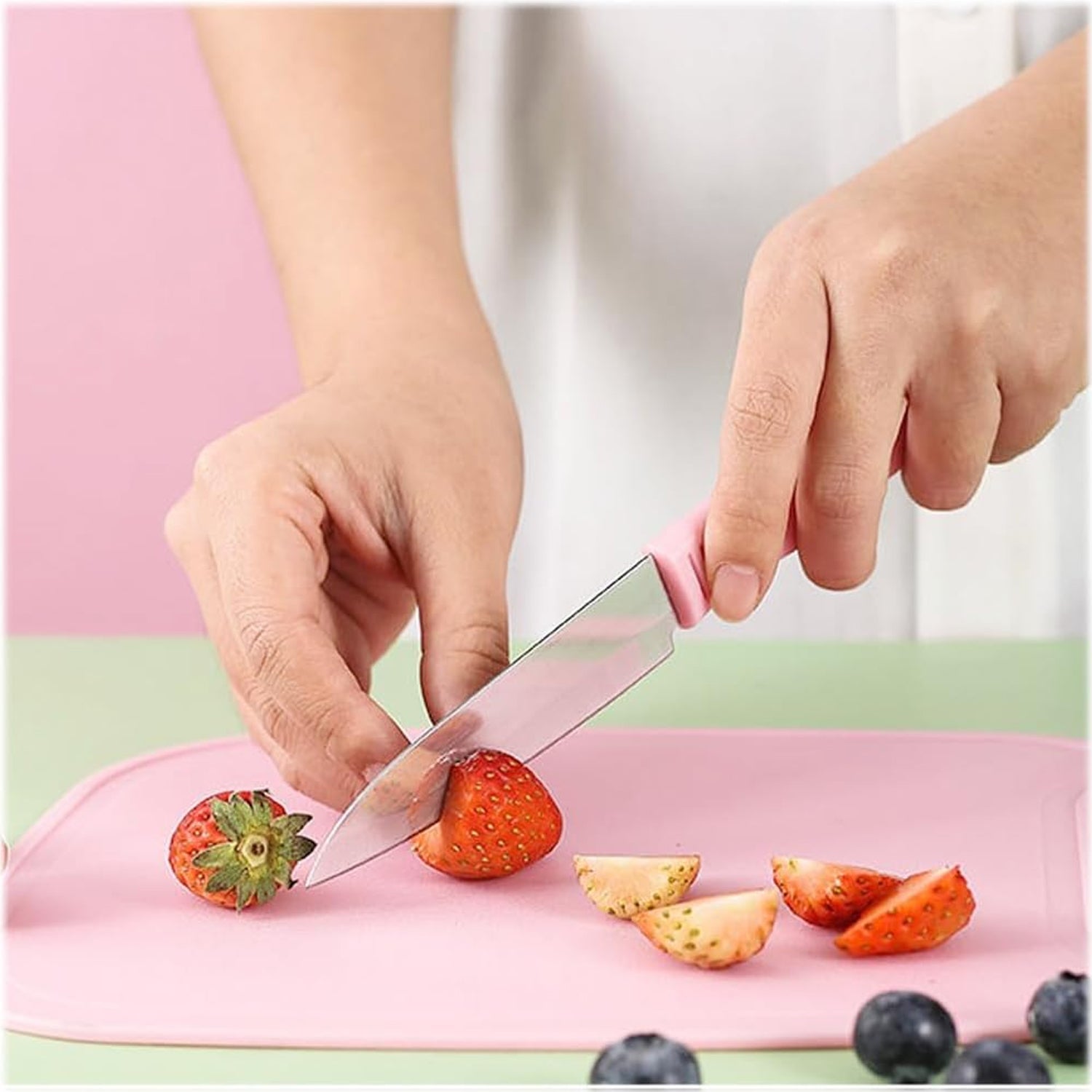 Miniature cutting board and sharp knife for camping and picnics.