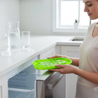Green oval silicone ice cube mold for beverage and culinary use