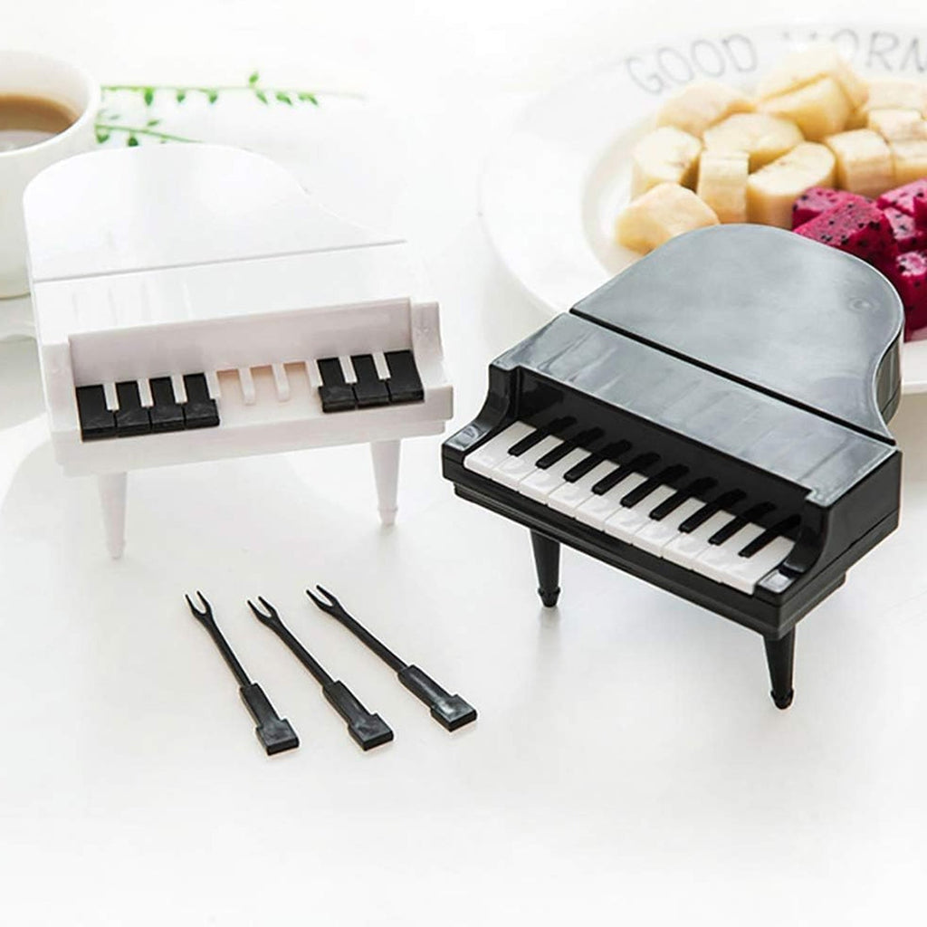 A child happily using the piano-shaped snack forks, making healthy eating fun and engaging.