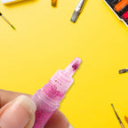 Close-up of glitter glue pen applicator for precise crafting