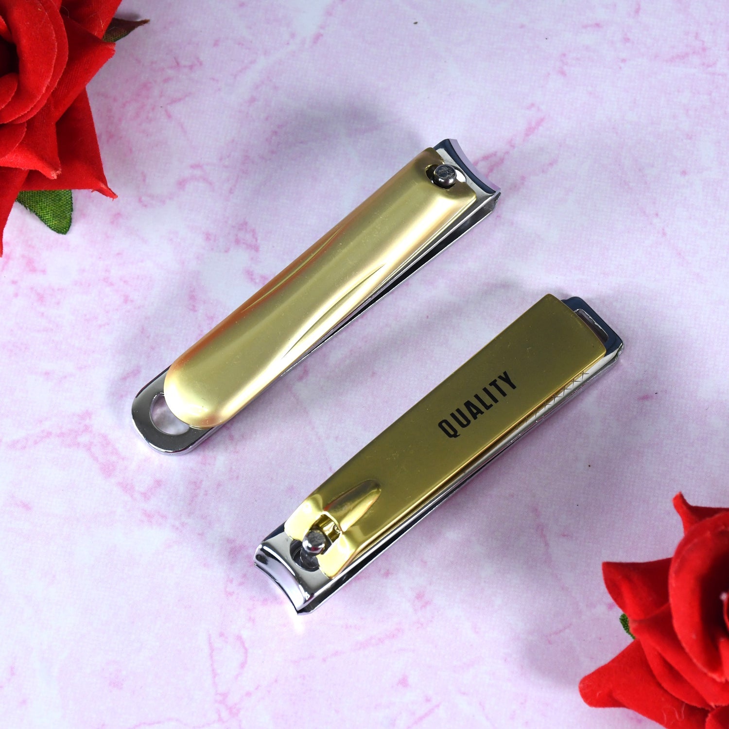 The folding nail clippers partially open, clearly showing the integrated nail file feature.