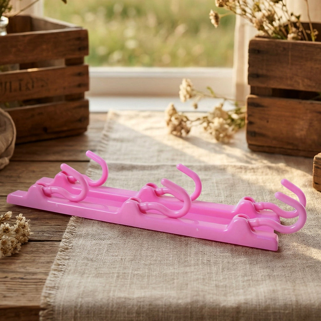 Kitchen hanger hook organizer in vibrant pink for compact storage