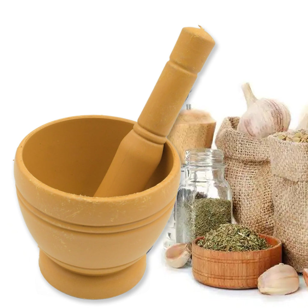 Mortar and pestle set displayed with fresh herbs and measuring spoons.