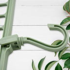 Durable plastic multi-hole hanger displaying its non-slip design for clothes organization.