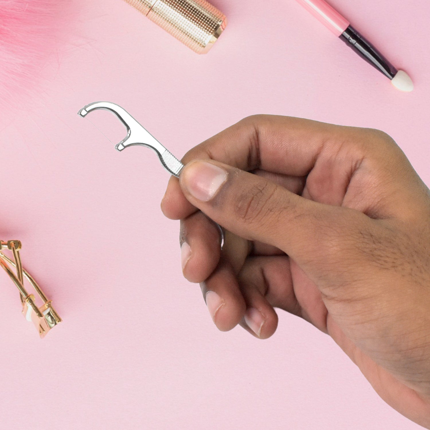 AuriGlam 7-piece stainless steel toothpick and floss kit, ready for travel.
