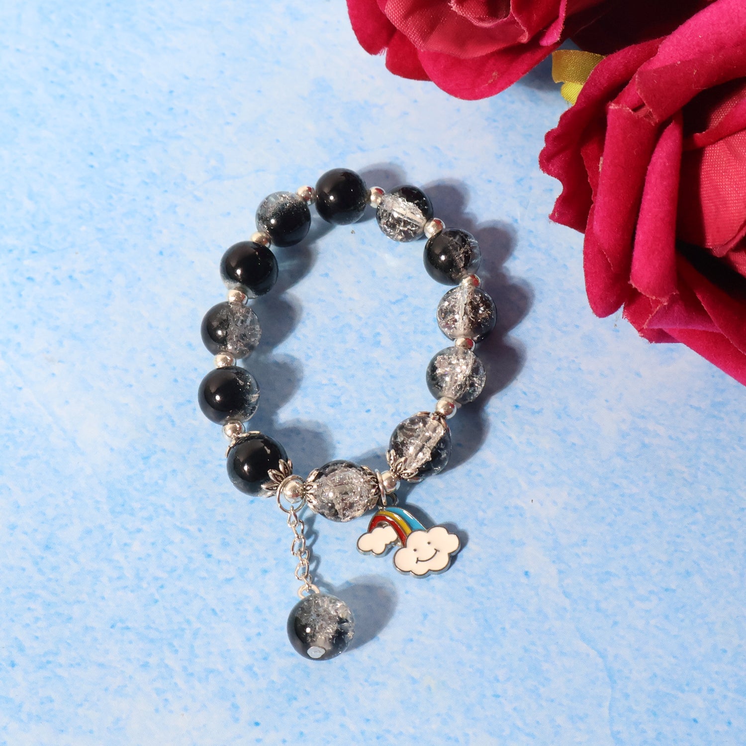 Stretchable fashion bracelet featuring cloud and rainbow enamel charm
