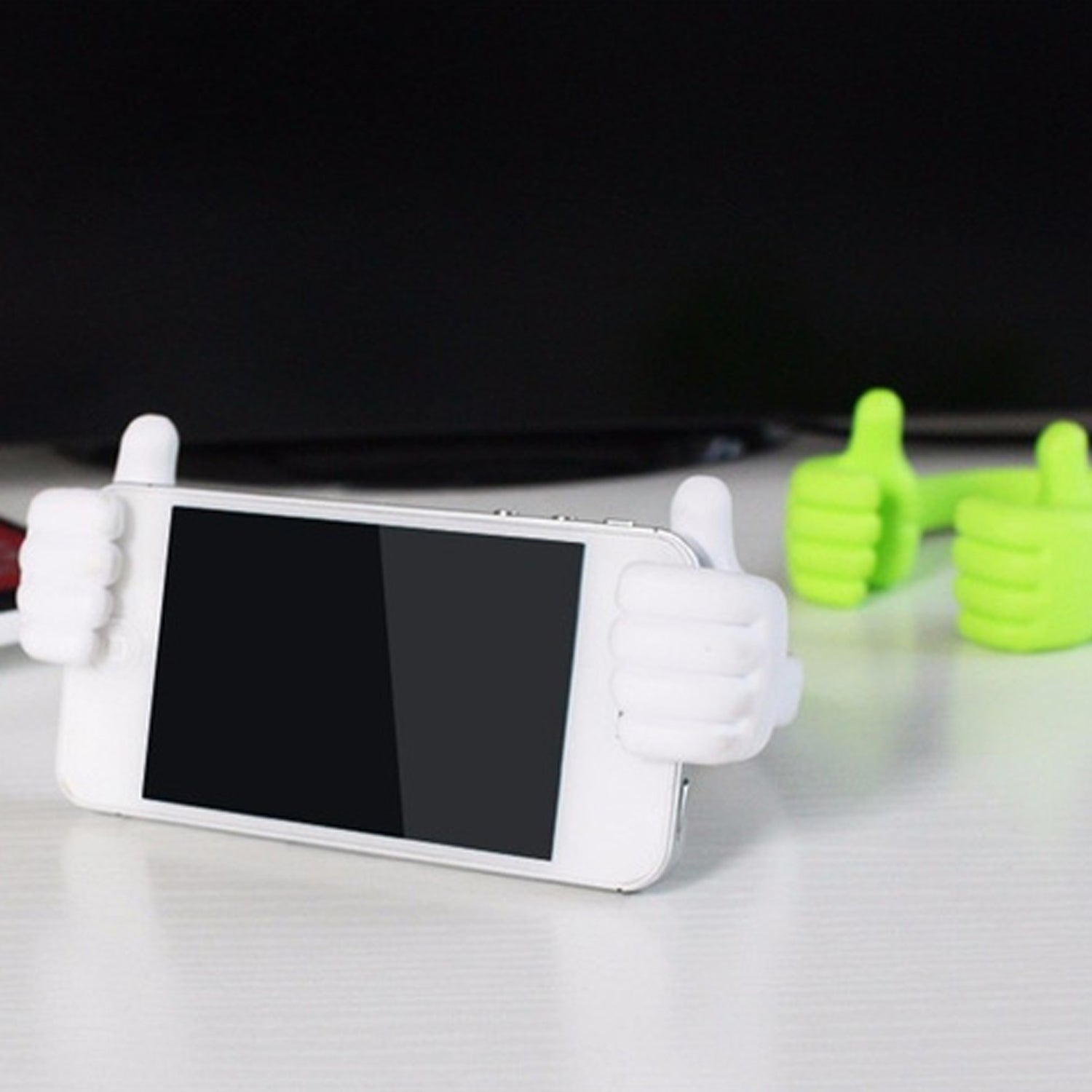 A blue hand shape mobile stand angled to provide optimal viewing for a mobile device.