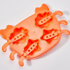 The crab-shaped ice mold filled with liquid, ready for freezing.