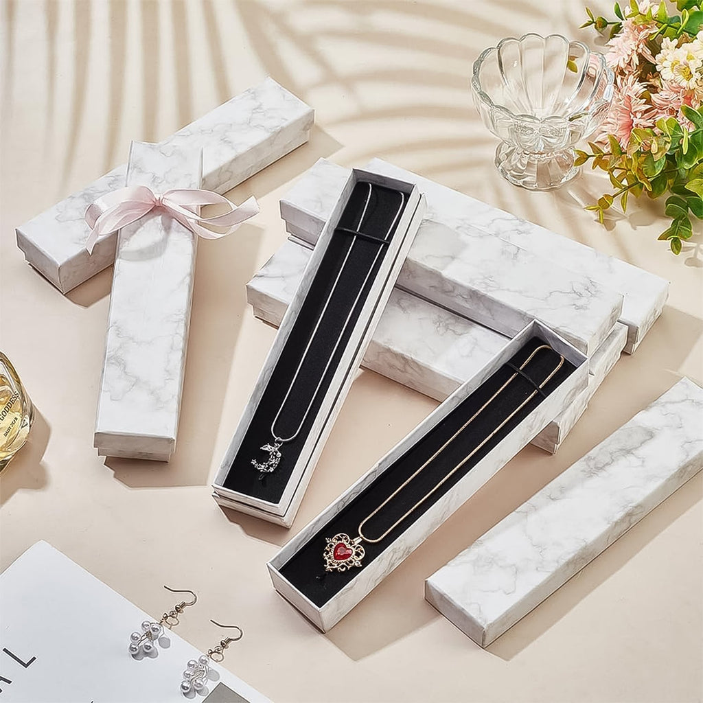 Closed view of the elegant jewelry gift box, 21x5cm, featuring a sophisticated velvet insert.