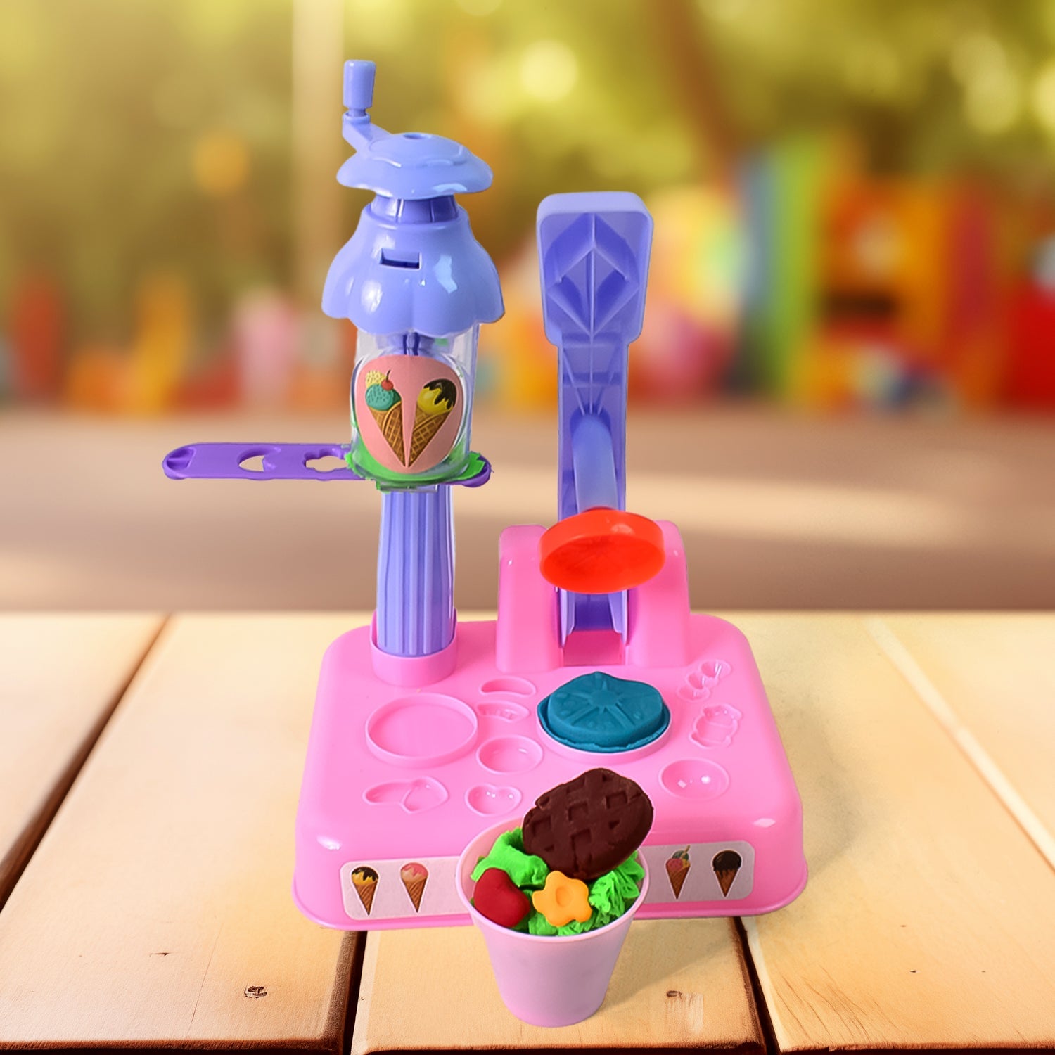 Various colourful dough creations and tools from the ice cream maker toy kit.