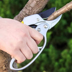 Pruning shears tool resting on garden deck showing sturdy construction