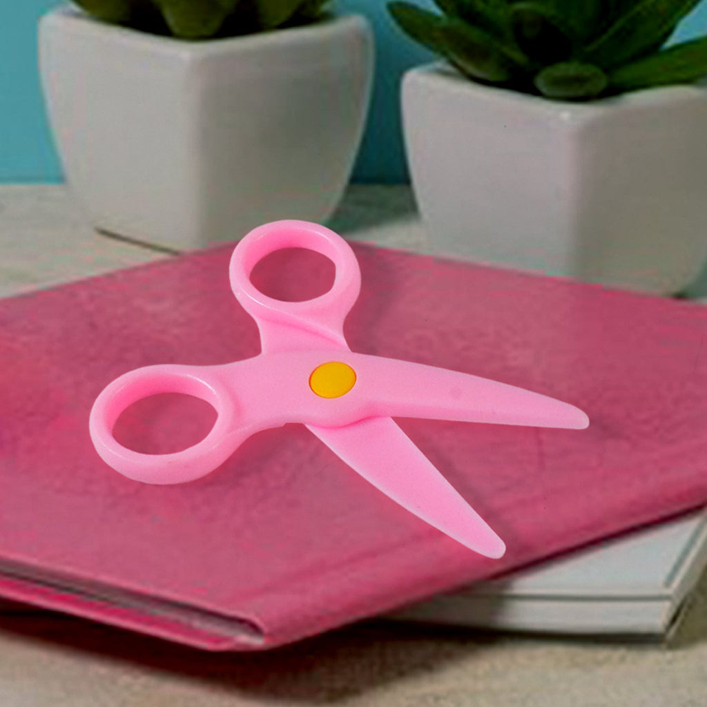 Multiple child-safe plastic scissors in a vibrant set for preschool arts and crafts.