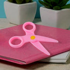 Multiple child-safe plastic scissors in a vibrant set for preschool arts and crafts.