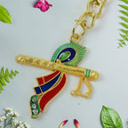 Peacock feather design on a Krishna flute devotional metal keychain