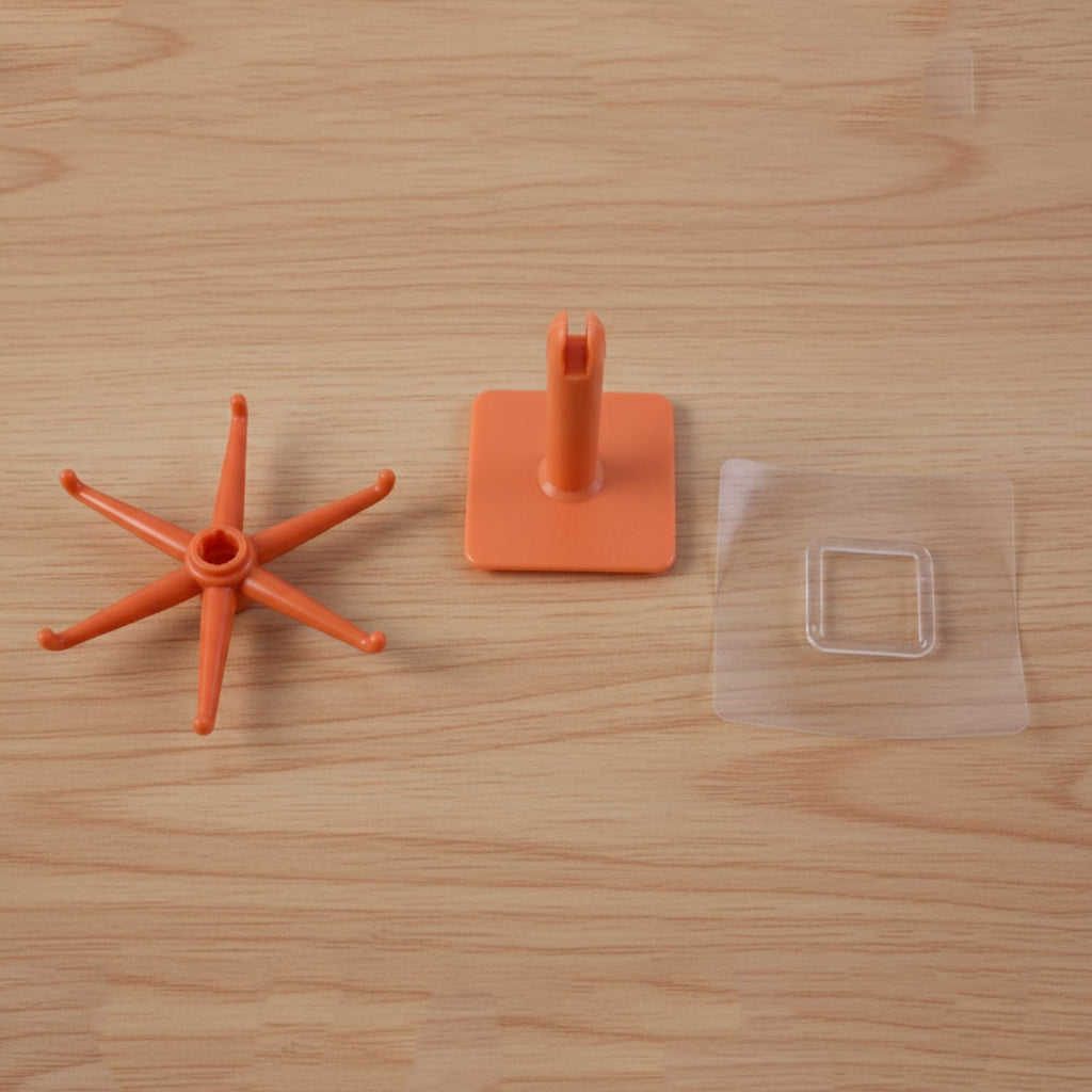 Orange multi-hook kitchen utensil hanger from different angle